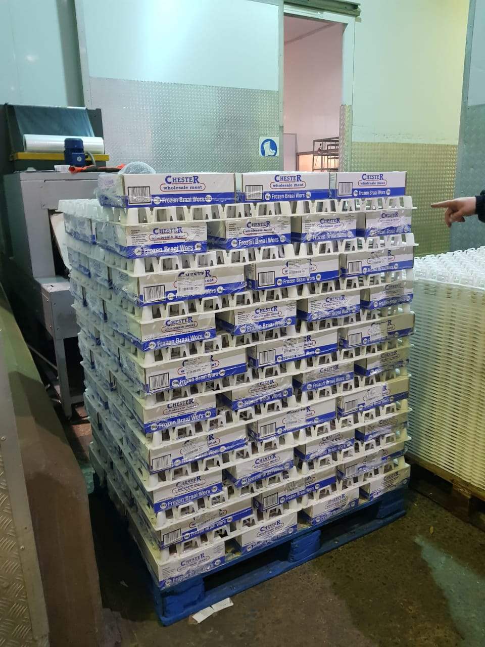 Stacked pallets with easyFLO freezer spacers in a cold room